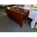 A mahogany drop leaf table