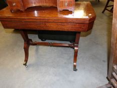 A mahogany fold over games table