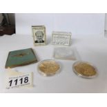 An R.A.F compact, 2 advertising match box holders, 2 silver Churchill commemorative coins