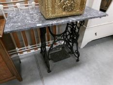A garden table with treadle sewing machine base