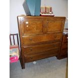 A walnut 2 door, 3 drawer cabinet