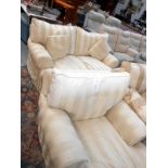 A cream striped sofa and chair