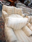 A cream striped sofa and chair