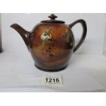 A Royal Doulton Dicken's series ware teapot,
