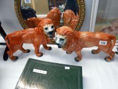A pair of Staffordshire lions 1 a/f
