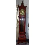 A French style Grandfather clock in cherry wood with onion base and brass arched dial