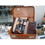 A gentleman's travelling vanity case and a small retro suitcase