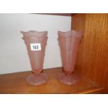 A pair of pink glass vases