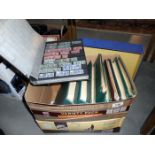 A box containing 9 albums of stamps