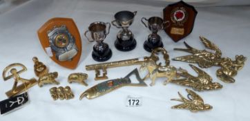 A box of brass items and trophies
