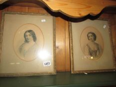 A pair of oval portrait prints