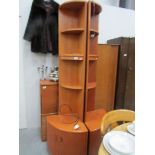 A pair of teak corner cabinets