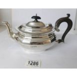 A silver tea pot,