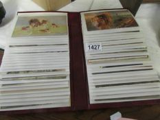 An album of 100 mainly animal old postcards