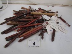 Approximately 85 lace bobbins in various exotic woods including snake, olive,