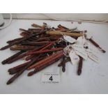 Approximately 85 lace bobbins in various exotic woods including snake, olive,