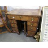 An original Queen Anne kneehole desk