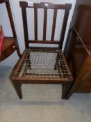 An early chair with string seat
