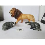 A Beswick lion and 2 badgers