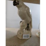 A cream ceramic falcon,