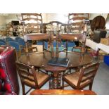 An oak gate leg dining table and a set of 6 dining chairs