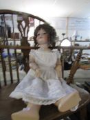 A 19th century porcelain headed doll marked Armand Marseilles, Germany, 390N, 11.