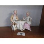 A German bisque porcelain nodding head group of lady and gentleman playing chess (ladies hand is
