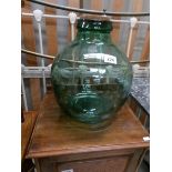 A large glass carboy