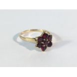 A 9ct gold garnet cluster ring,