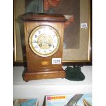 A 19th century mahogany mantel clock with shell inlay
