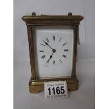 A brass carriage clock,