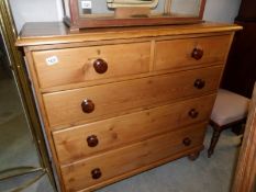 A 2 over 3 pine chest of drawers