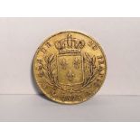 A Louis XVIII 1815 French gold 20 francs coin,