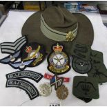 An Australian military hat and badges