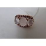 A gold on silver 3 stone ring,