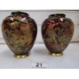 A pair of Carlton ware rouge royale vases (missing lids,