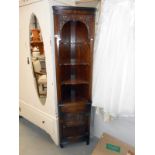 An oak corner cupboard