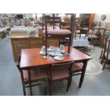A dining table and 5 chairs
