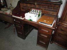 An oak roll top desk