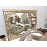 A gilt framed mirror