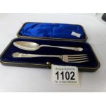 A cased silver spoon and fork