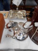 A silver plate teapot, sugar scuttle,