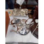 A silver plate teapot, sugar scuttle,