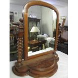 A mahogany toilet mirror