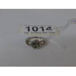 An 18ct white gold ring set with tourmaline and diamond