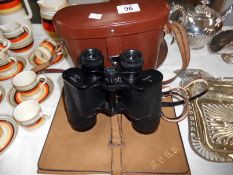 A fine cased pair of Jena 15 x 50 binoculars and a leather stationery wallet with dip pen