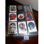 An album of 8 sets of fantasy trade cards
