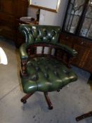 A green leather office chair