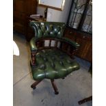 A green leather office chair