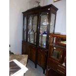 A mahogany astragal glazed cabinet